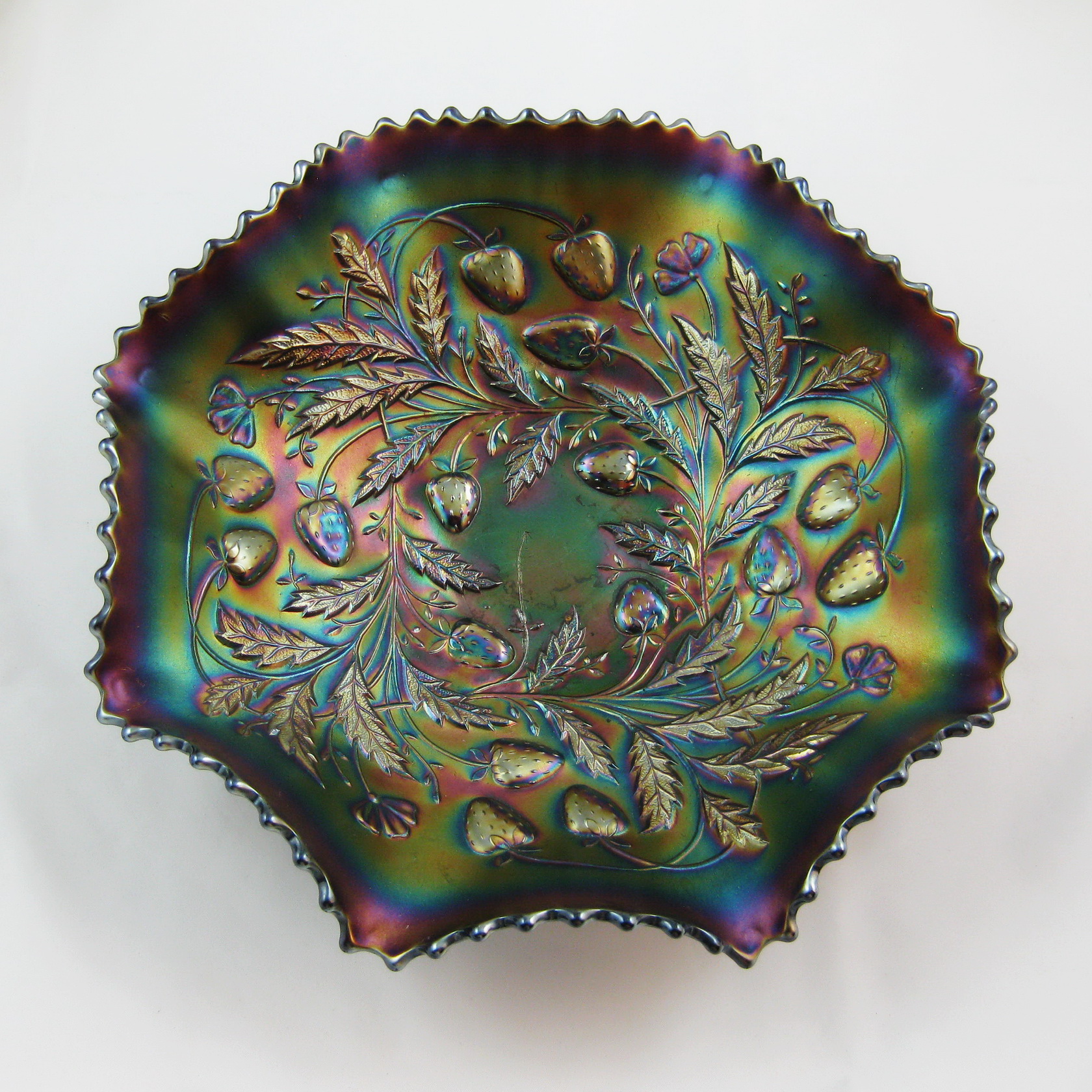2.5 inches high. amethyst bowl 8.5 inches diameter Produced by Northwood 1910 to 1914 Carnival glass Strawberry ruffled